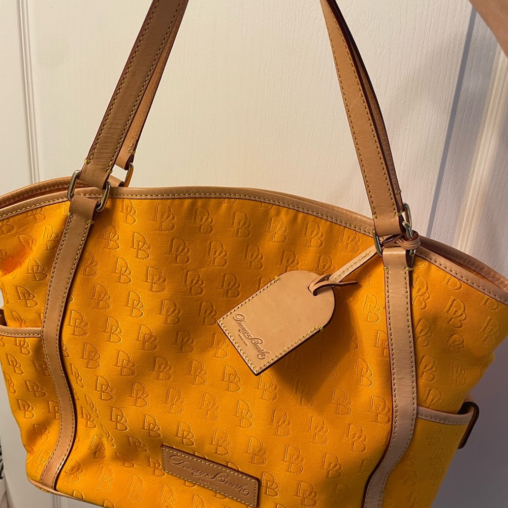 Dooney and Bourke canvas tote in a mustard yellow. EUC